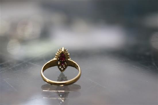 An early-mid 20th century 18ct gold, ruby and diamond marquise cluster ring, size M.